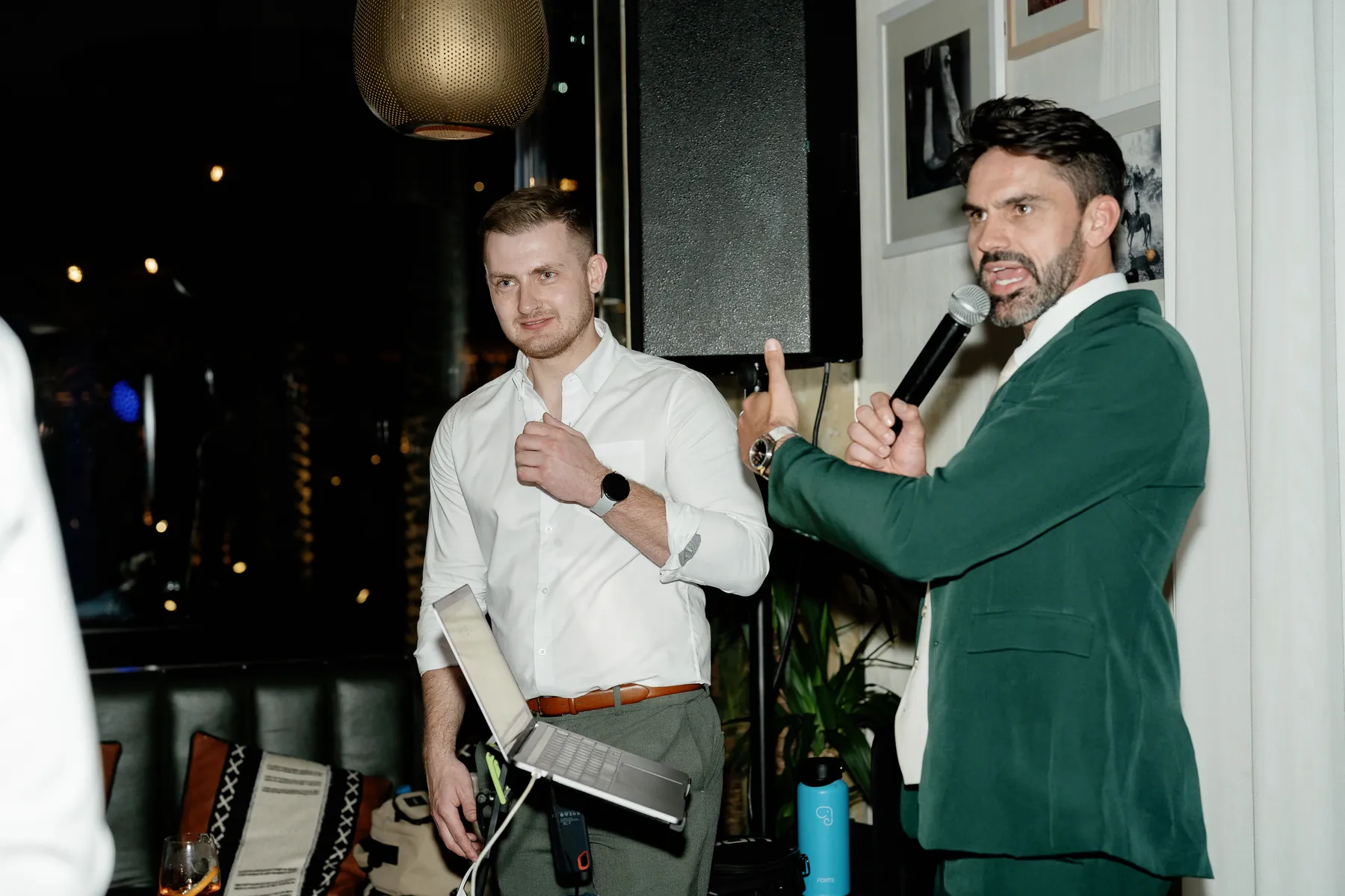 Darryl Rees in a green suit hosting a wedding reception in Dubai