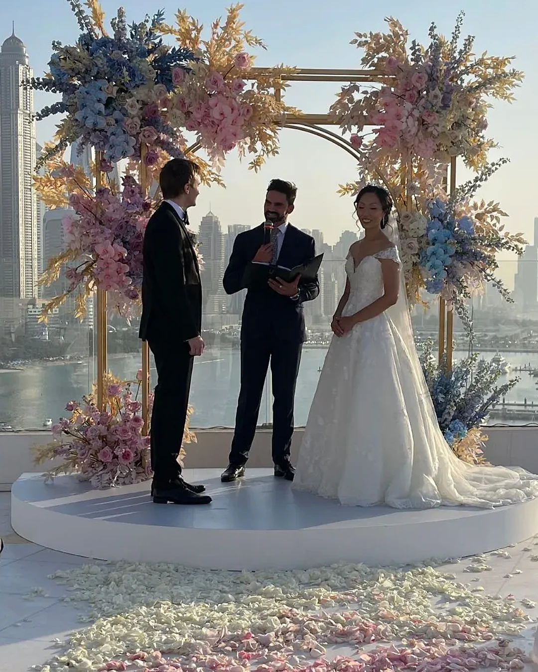Darryl Rees hosting a rooftop wedding ceremony overlooking Dubai Marina