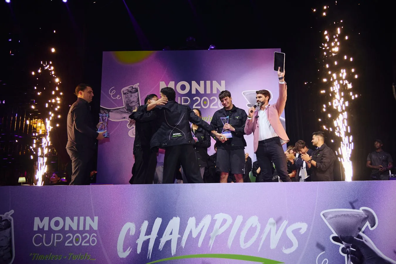 Darryl Rees hosting the Monin Cup 2026 final on stage in Dubai